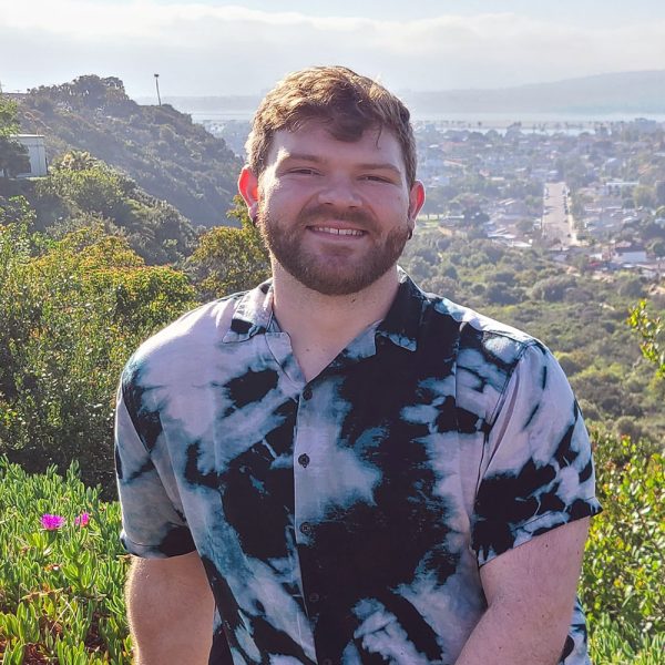 Jeff Rogers with view of city below.