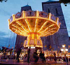 Carousel in front of St Peter’s Cathedral during “Maiwoche”